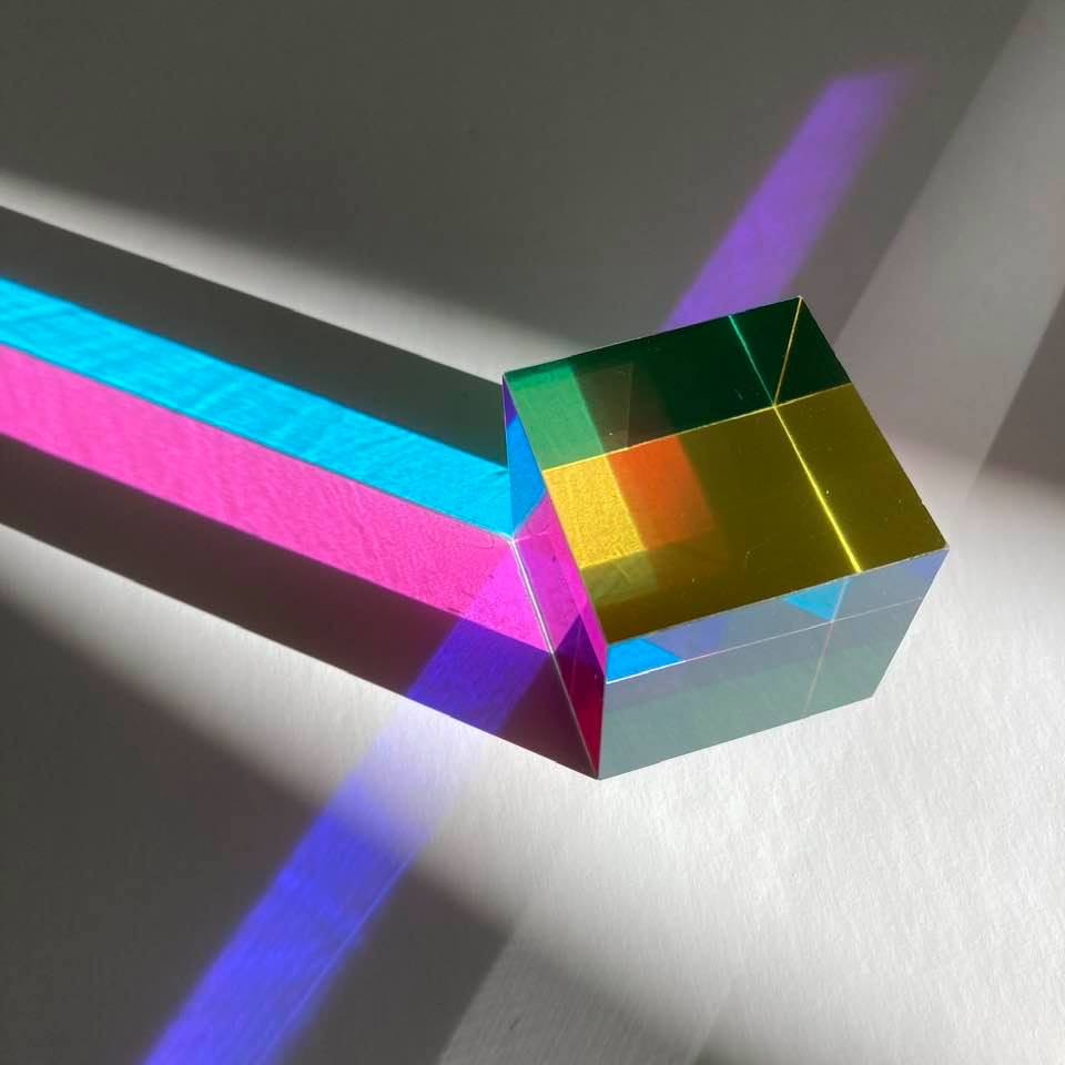 A CMY Cube held up to the light, colours overlapping