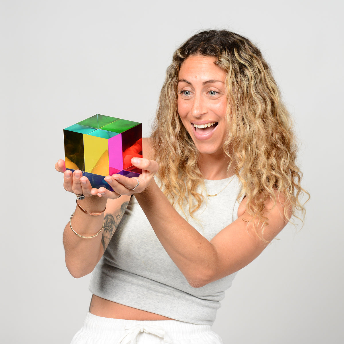 The Original CMY Cube held in hand, colours mixing where the translucent faces overlap