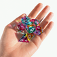 The Septem Aleae dice set displayed with its box and pouch