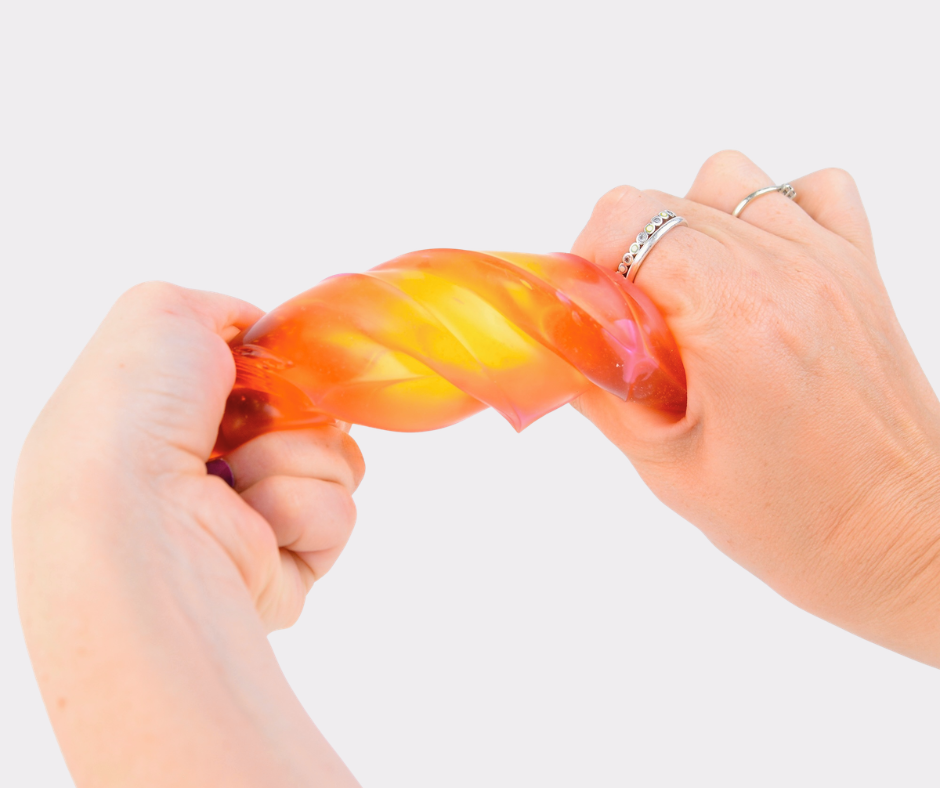 Hands twisting an orange and yellow translucent PolySquish squishy toy