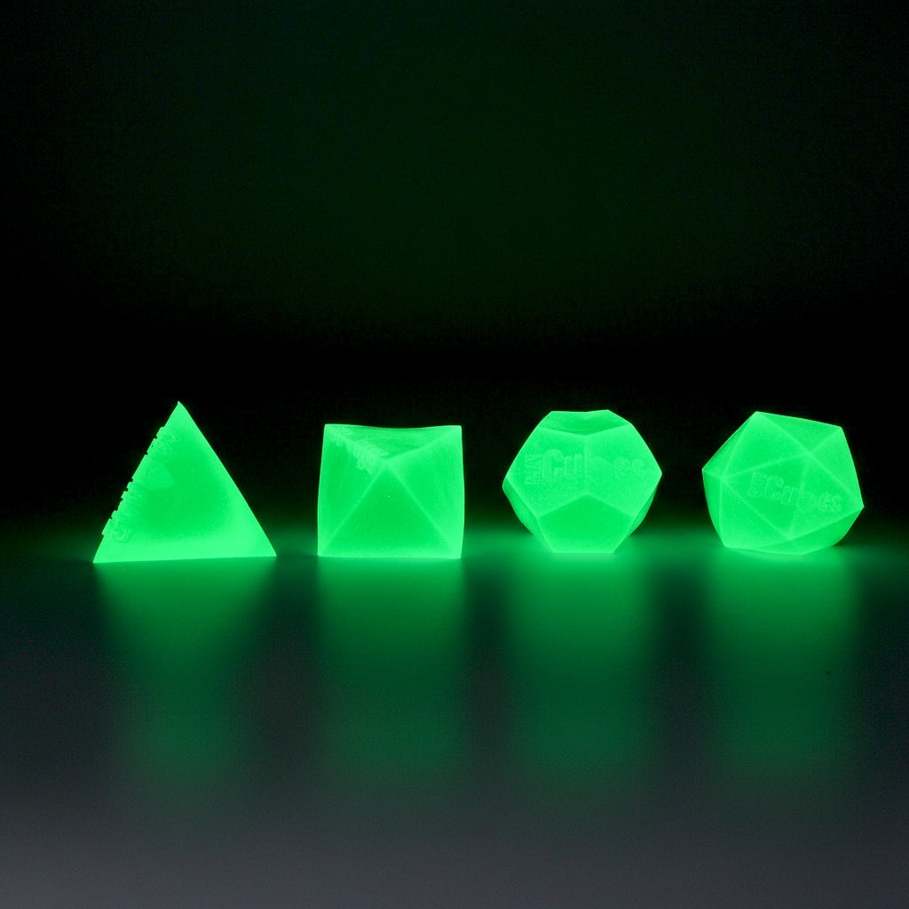 Four glow-in-the-dark CMY Cubes polyhedra glowing green in the dark