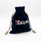 Navy velvet CMY Cubes drawstring pouch included with the Septem Aleae dice set